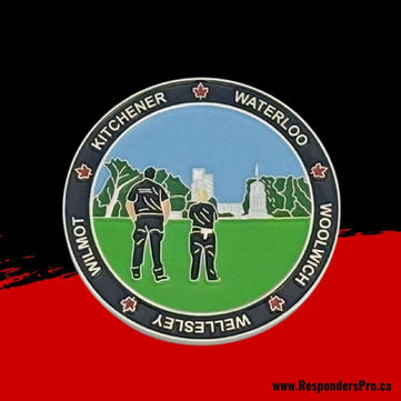 Round EMS challenge coin featuring paramedics with a green and blue background.