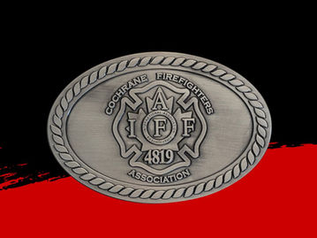 An antique oval belt buckle featuring a Maltese cross insignia in the center.