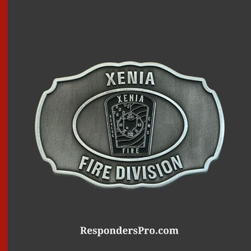 An antique silver belt buckle with a stylized Fire Division emblem in the center.