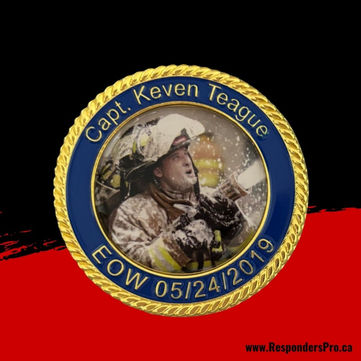 Commemorative challenge coin: firefighter in full gear with fire hose. Round, full-colour image.