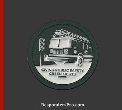 A corporate challenge coin featuring a fire truck and a set of traffic lights. The coin is round and uses a green, black, and white color scheme.