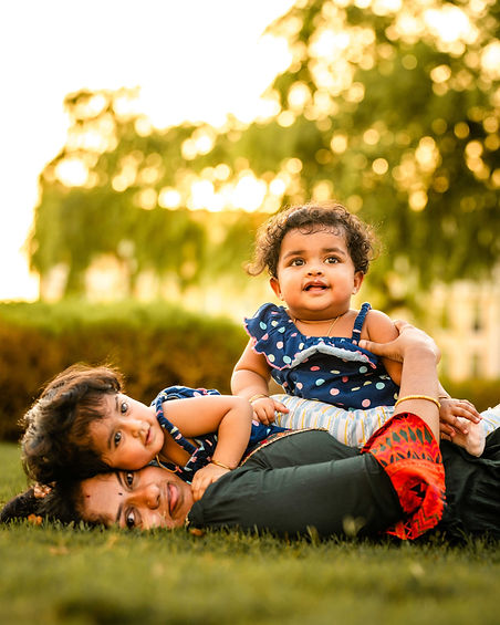 family-two-children-laying-on-grass-photoshoot-dubai-lens-and-graphics-33.jpg