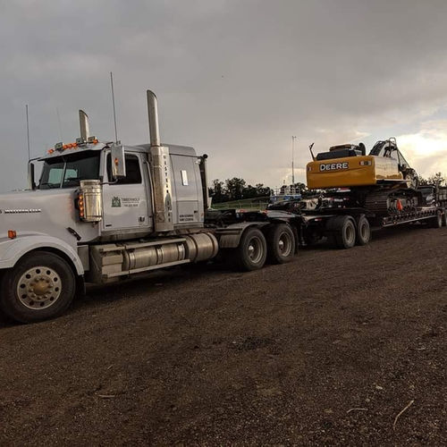 track-hoe loaded sunset