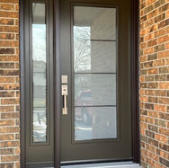A picture of a designer glass entrance door