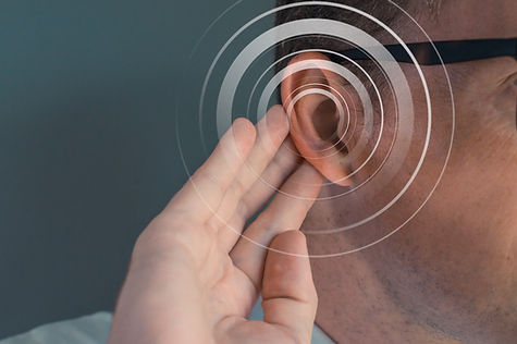 Image showing a man putting his hand on his ear to carefully listen to a sound