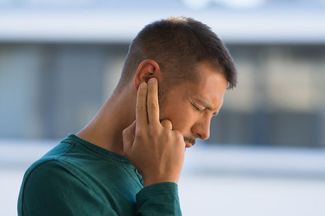 Image showing a man suffering from tinnitus