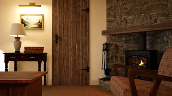 Traditional cottage living room with stone fireplace and wood-burning stove.