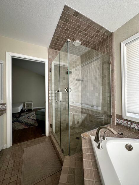 View of original shower with pink tile