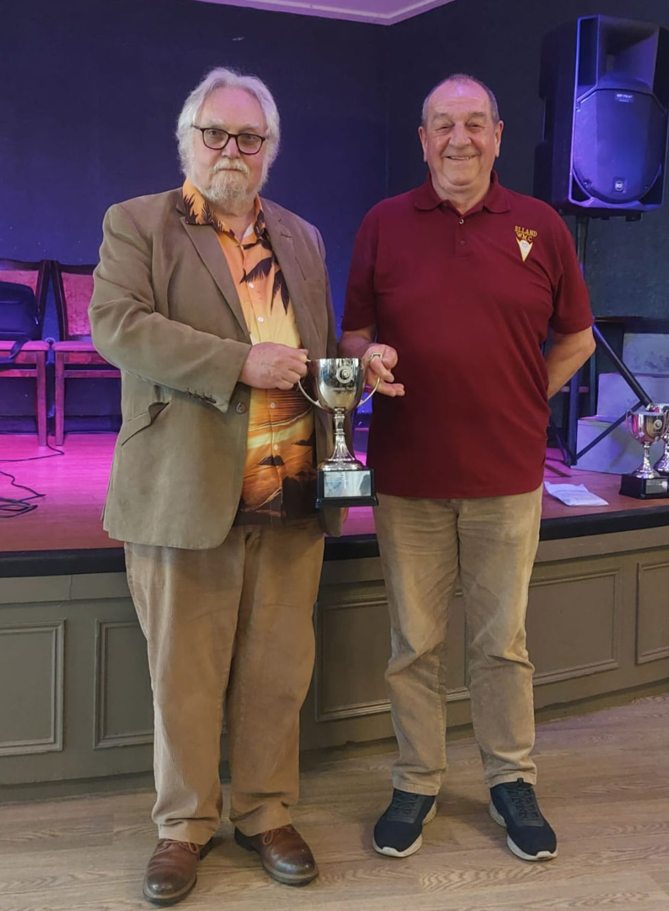 Elland WMC were the Division 5 Champions and here team captain Philip Binns collects the Leonard Tracey Cup on behalf of his team