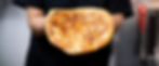 Golden and fluffy malawah fried and held in hands