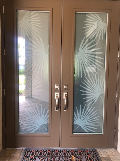 Privacy custom film design with palm fronds. Created specifically for the customer main door design