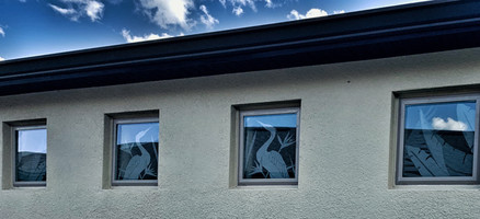 NS100M and NS700M (nature designs) adapted to 4 small windows to create a mirrored scene. white frost design on clear frost background.