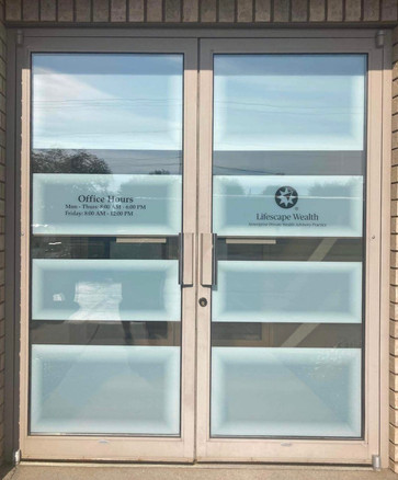 Office front glass door design for LifeScape Wealth Management in Marshfield Wisconsin. 2 Rectangles with concentric shaded effect. Building door design with custom decorative film in various frost tones. Logo, hours of operations and phone added.