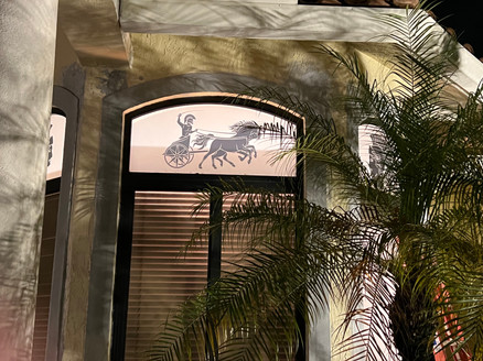Custom decorative design with roman chariot, soldier and horses in black textured frost. Medium opacity