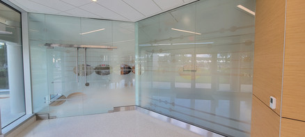 Glass room/partition design representing a music score. white frost and clear frost on the right wall, white frost and clear on the left wall. Two different privacy requirements.