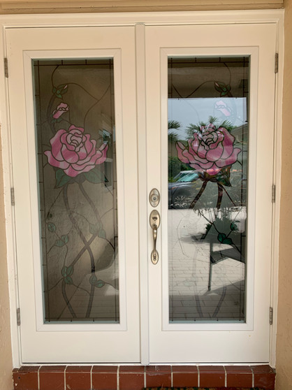 View of decorative front door from outside. The Decorative custom film for glass is perfectly visible, as the actual glass would be.