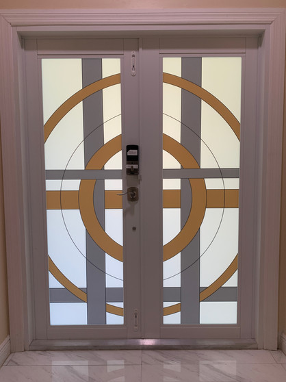 colored frost design on a while frost glass. High contrast necessary to make the front door design visible from both sides. Art Decò decorative film design with the appearance for etching.