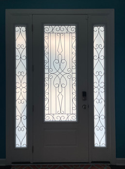 Custom Decorative glass film created to fit specifically this space. Customer's requested the design specifically. Tailored to the size of sidelights and door.
