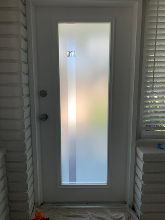 Front door design for a clear glass door. A simple yet rich design made of two frosted textured. A 40% white frost with a granite finish and hand-drawn lines on clear frost.