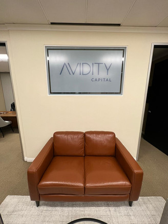 Custom decorative window design with customer's logo in colored frost on a white frost background.