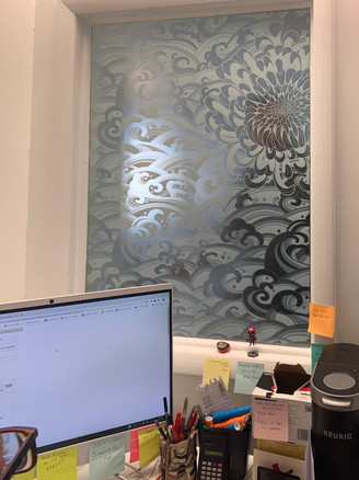Decorative film to create privacy for the office space while simultaneously showcase decoration. the other side of the window is the showroom space of this Window and Door Dealer.