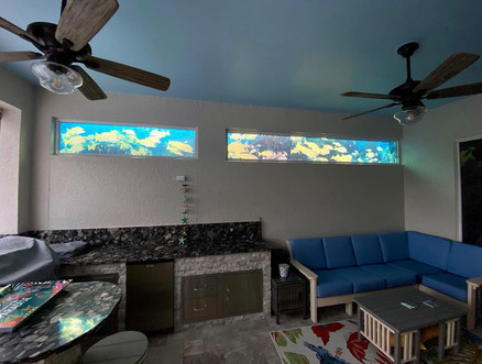 colored decorative custom window film applied to two long and narrow window. The garage of the home was repurposed to become and indoor-outdoor kitchen.