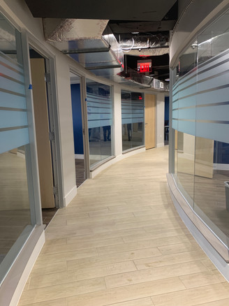 Custom Decorative film design in roll to roll with a 30.5" height. Height of each line of the design specifically requested by customer. White frost at 20% with 50% privacy layer.