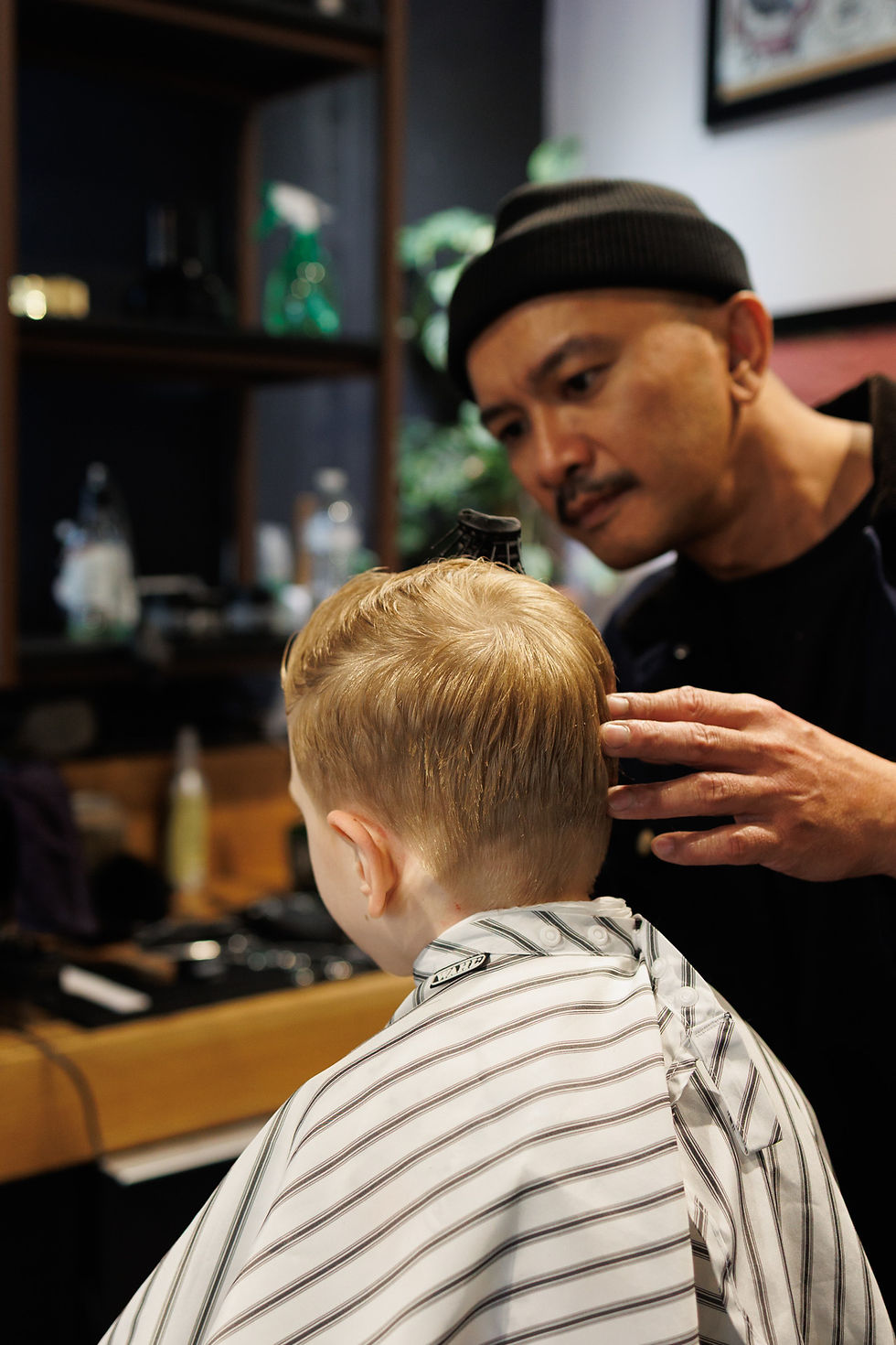 barber doing kids haircut