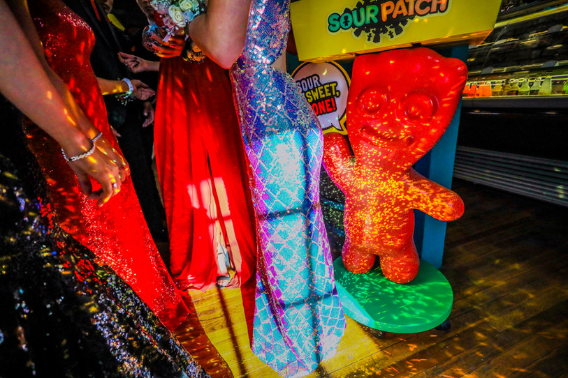 Glittery prom dresses cast sparkle on to a Sour Patch Kids candy display in Texas