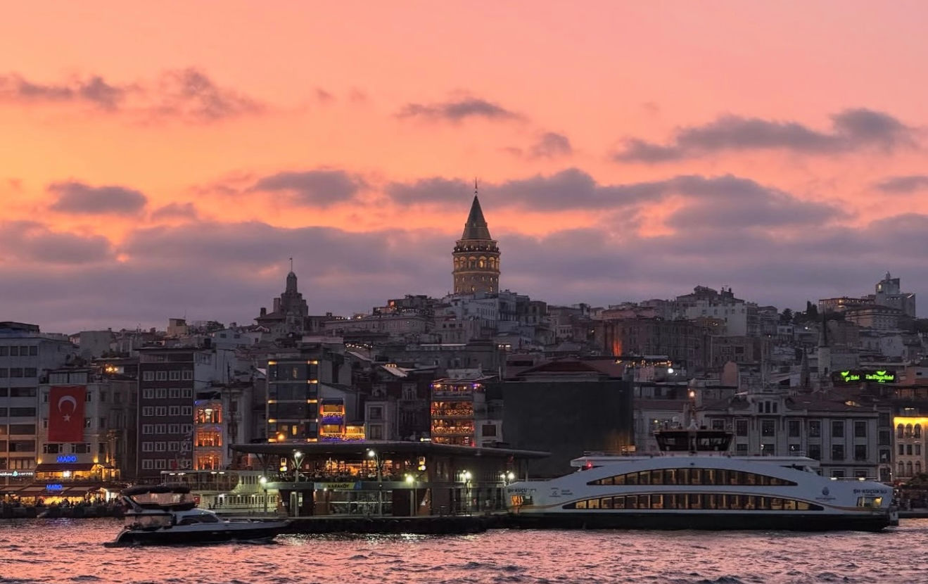 Galata Tower and the Istanbul skyline at sunset seen from the Bosphorus.