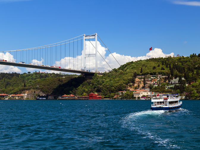 Bosphorus Bridge Istanbul with boat and sea view – scenic cruise experience in Istanbul