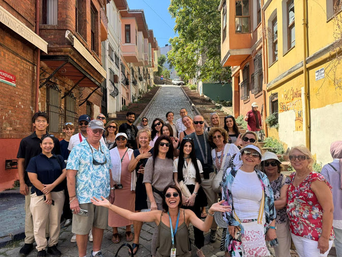 group of travelers in Istanbul during guided city tour experience in colorful Fener and Balat districts