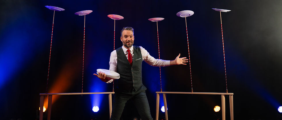 Juggling plate spinner circus act
