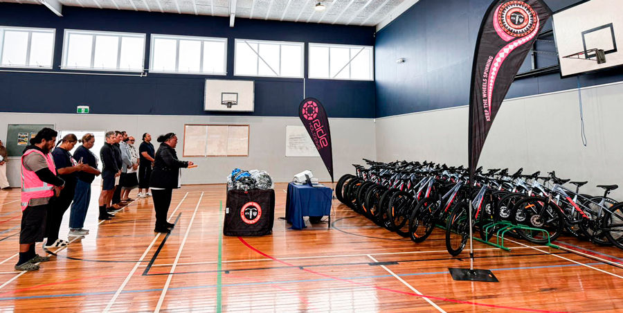 Matua Maehe from Māngere College blessing the 30 bikes gifted by Ride Holidays.