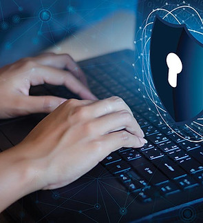 Hands using a laptop with a digital security shield illustration