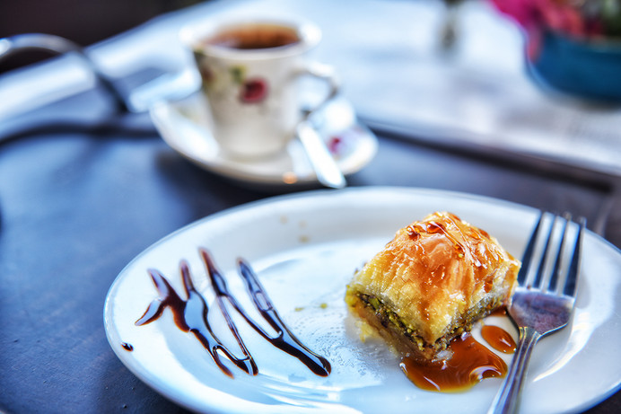 Delight in the sweet, flaky layers of our traditional baklava, a perfect pairing with a warm cup of coffee for a satisfying after-dinner treat.