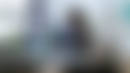 A man looking into a ring light