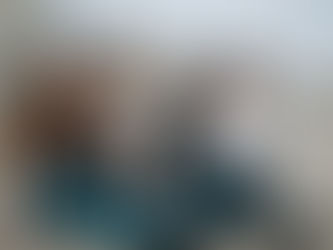 a family of 4 playing outside