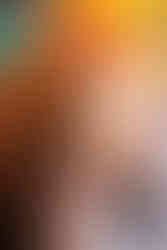 one year old sitting in his moms lap and holding her hand