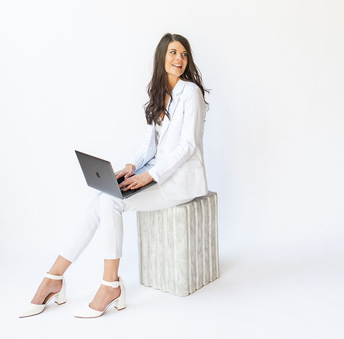 SEO Copywriter For Creatives Sitting On Stool With Laptop