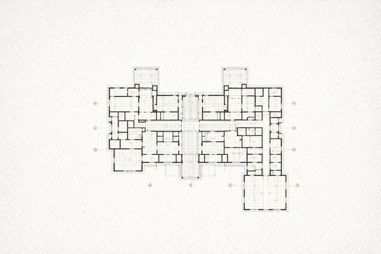 Pianta architettonica in bianco e nero di un edificio con più ali, linee di griglia e quote arancioni