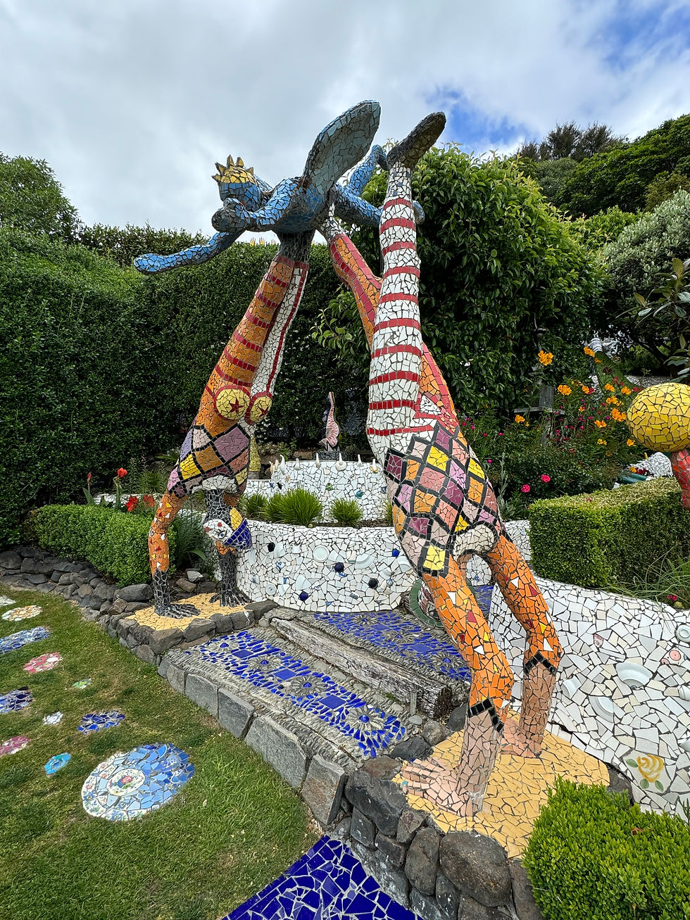 Here a pair of acrobats hold a winged figure over a set of steps.