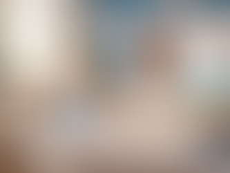 Eye-level view of a classroom with a teacher preparing lesson materials