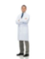 alt= A male health care professional with dark hair in a white lab coat with dress pants stands with his arms crossed