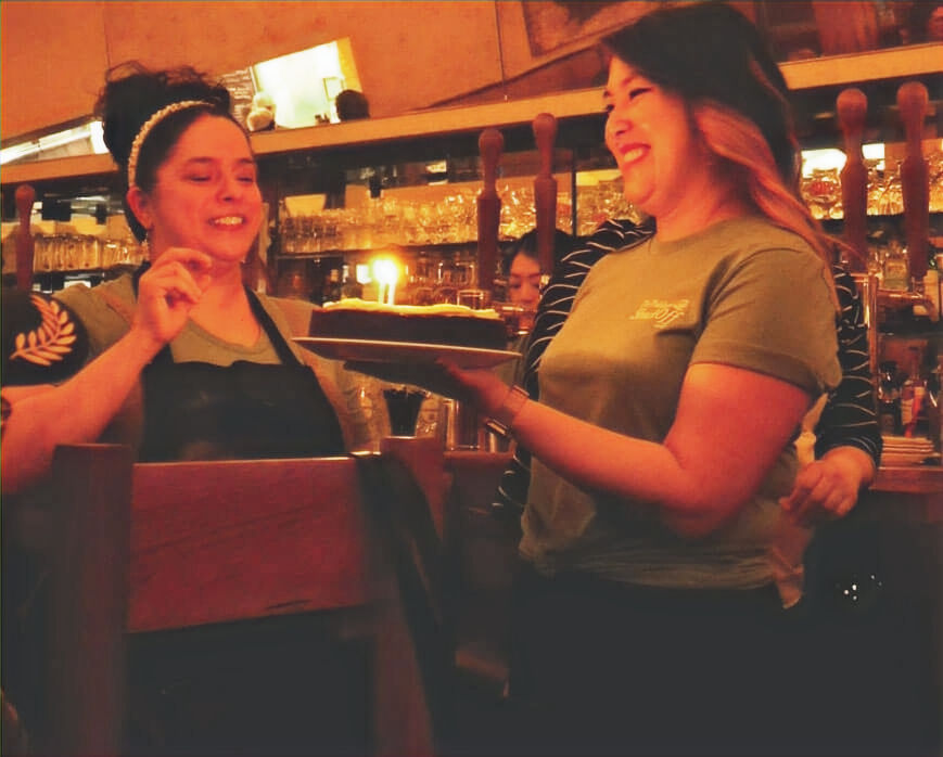 Chef Diana Davila (left) gave up part of her birthday to participate in the Shuck Off, and was rewarded with this beautiful chocolate cake. Photo by Bob Benenson.