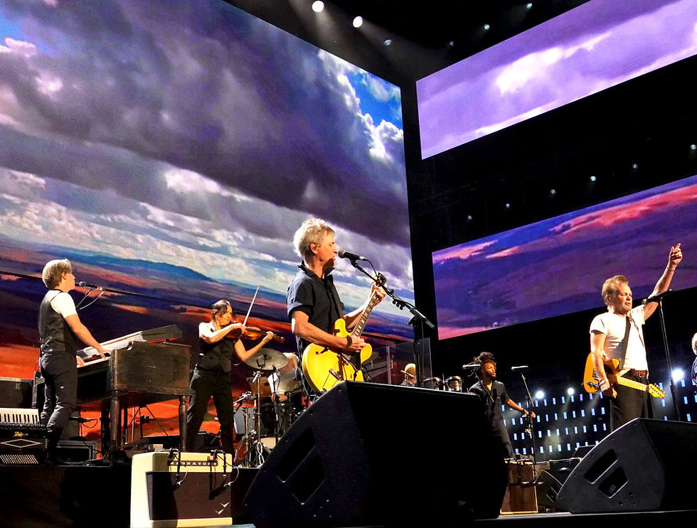 John Mellencamp and his band performing "Rain on the Scarecrow," the 1983 song that established him as a leading advocate for family farmers. Photo by Bob Benenson