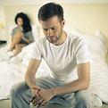 Frustrated couple in bedroom