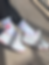 White crew socks with red baseball heart graphic and blue stripe accents, worn with sneakers for casual movement.