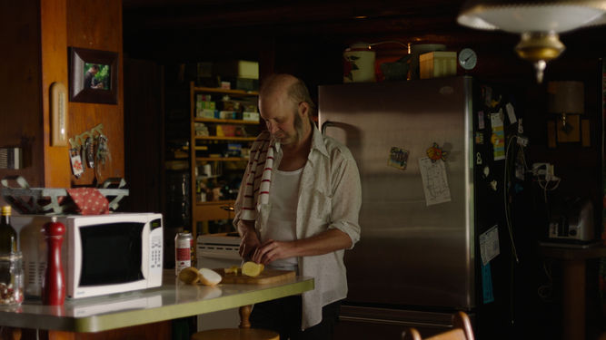 Harold making breakfast at the cottage on Pelee Island