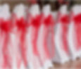 white chair cover and red bow